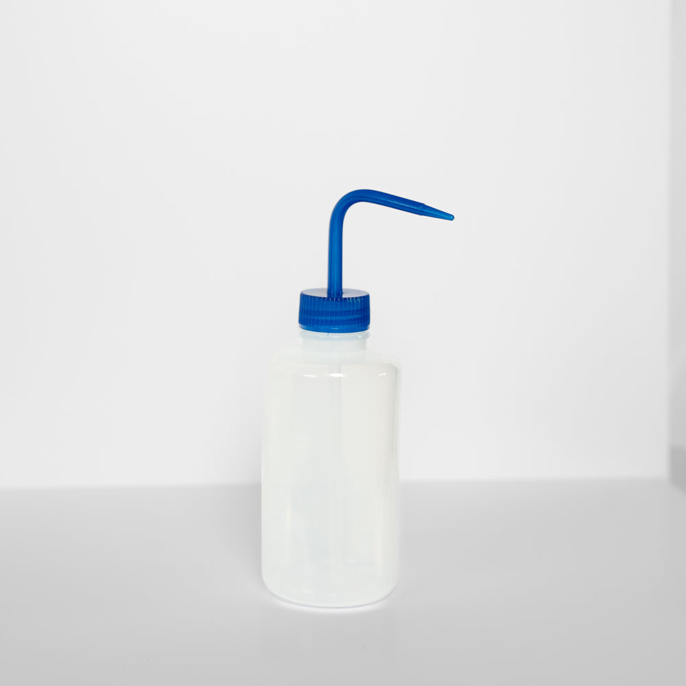 White bottle with a blue spout on a white background